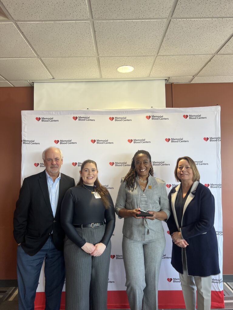 Dr. Charles Drew Lifesaver Award recipient Rae Blaylark, with Memorial Blood Centers staff.